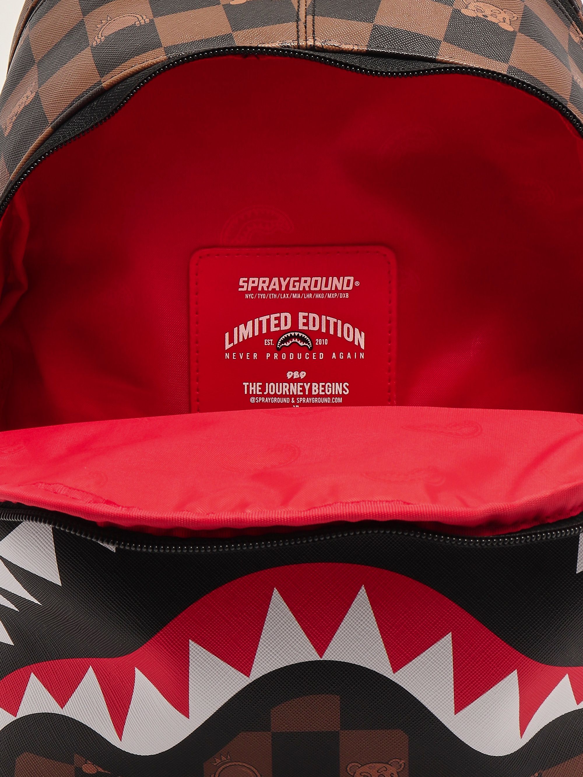 Peeking Character Check Savage faux leather backpack for