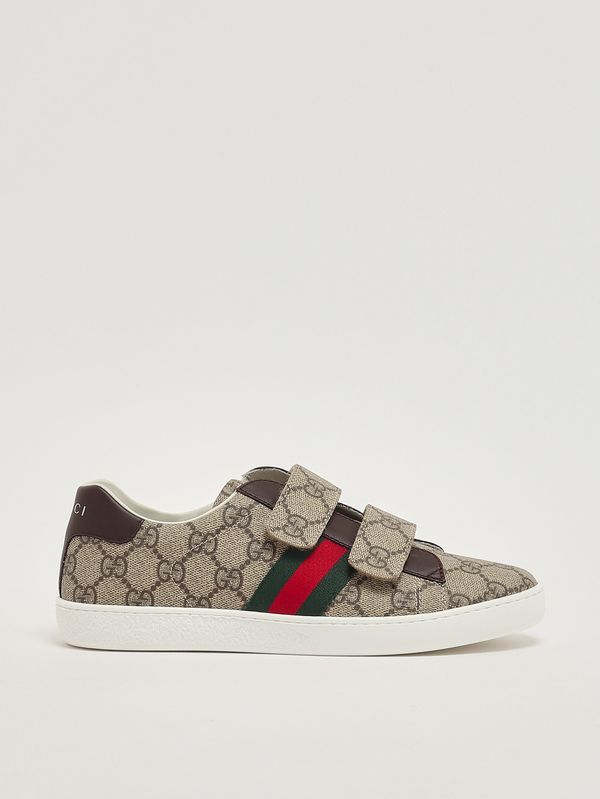 1. Zapatillas deportivas para niño en tejido GG Supreme y piel. Beige Gucci 463091facyf