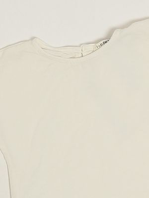 3. Camiseta de algodón para recién nacida Marfil